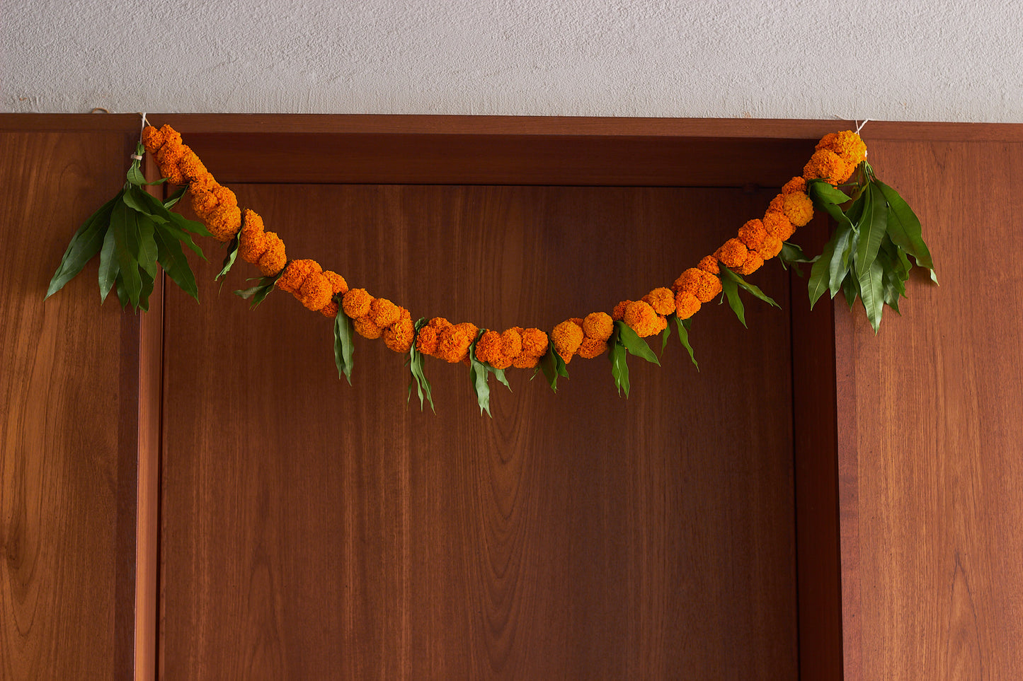 Orange Ambapala Toran - Mahua Floral Studio