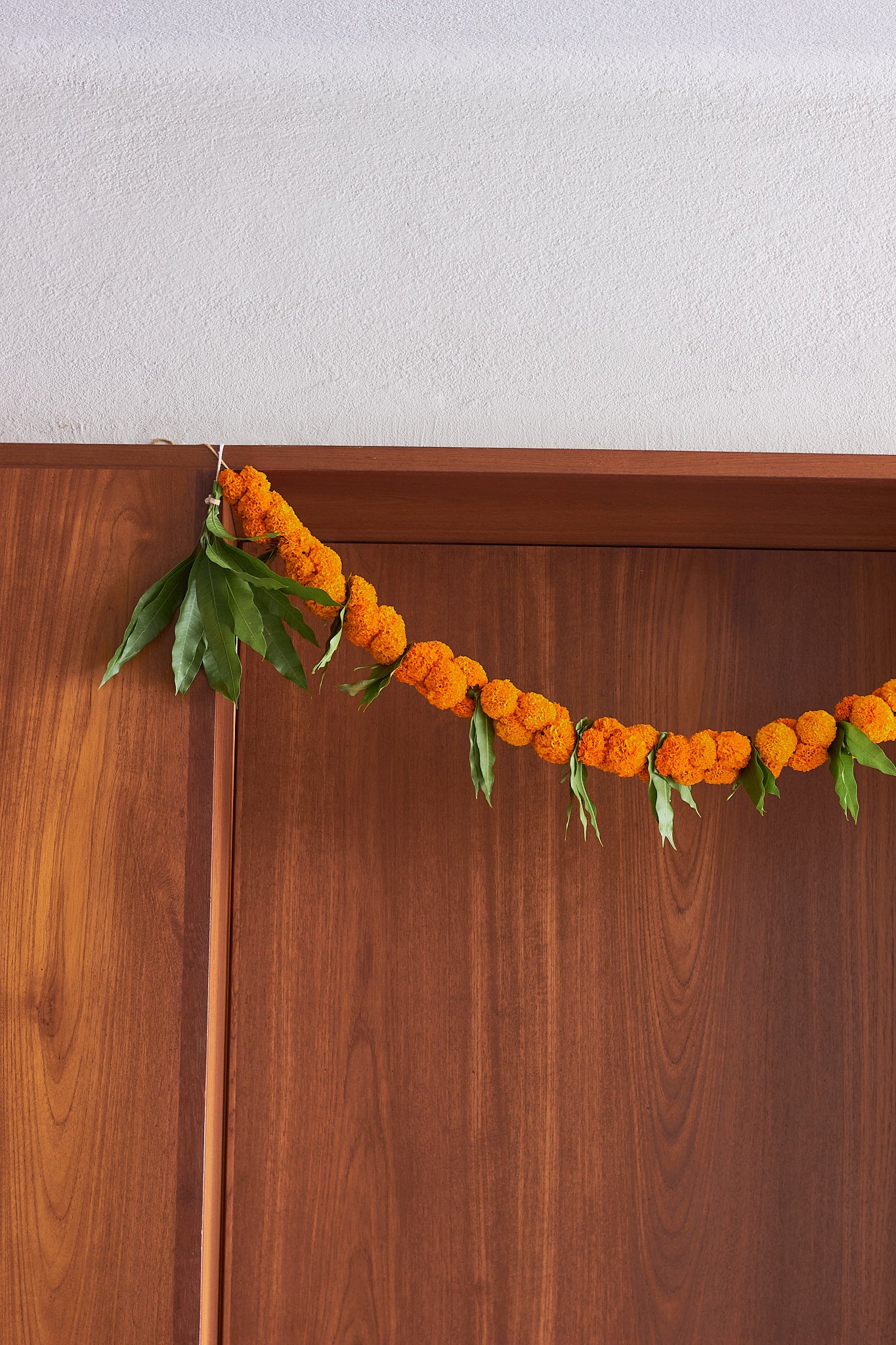Orange Ambapala Toran - Mahua Floral Studio