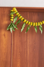 Buy Yellow Ambapala Toran by  Mahua Floral Studio.