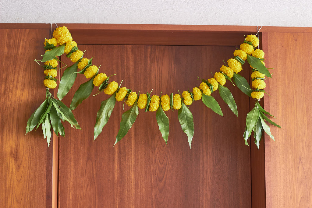 Buy Yellow Ambapala Toran by  Mahua Floral Studio.