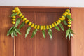 Buy Yellow Ambapala Toran by  Mahua Floral Studio.