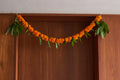 Buy Orange Ambapala Toran by  Mahua Floral Studio.