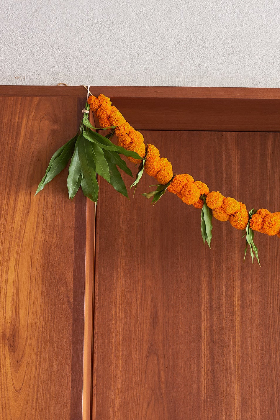 Buy Orange Ambapala Toran by  Mahua Floral Studio.