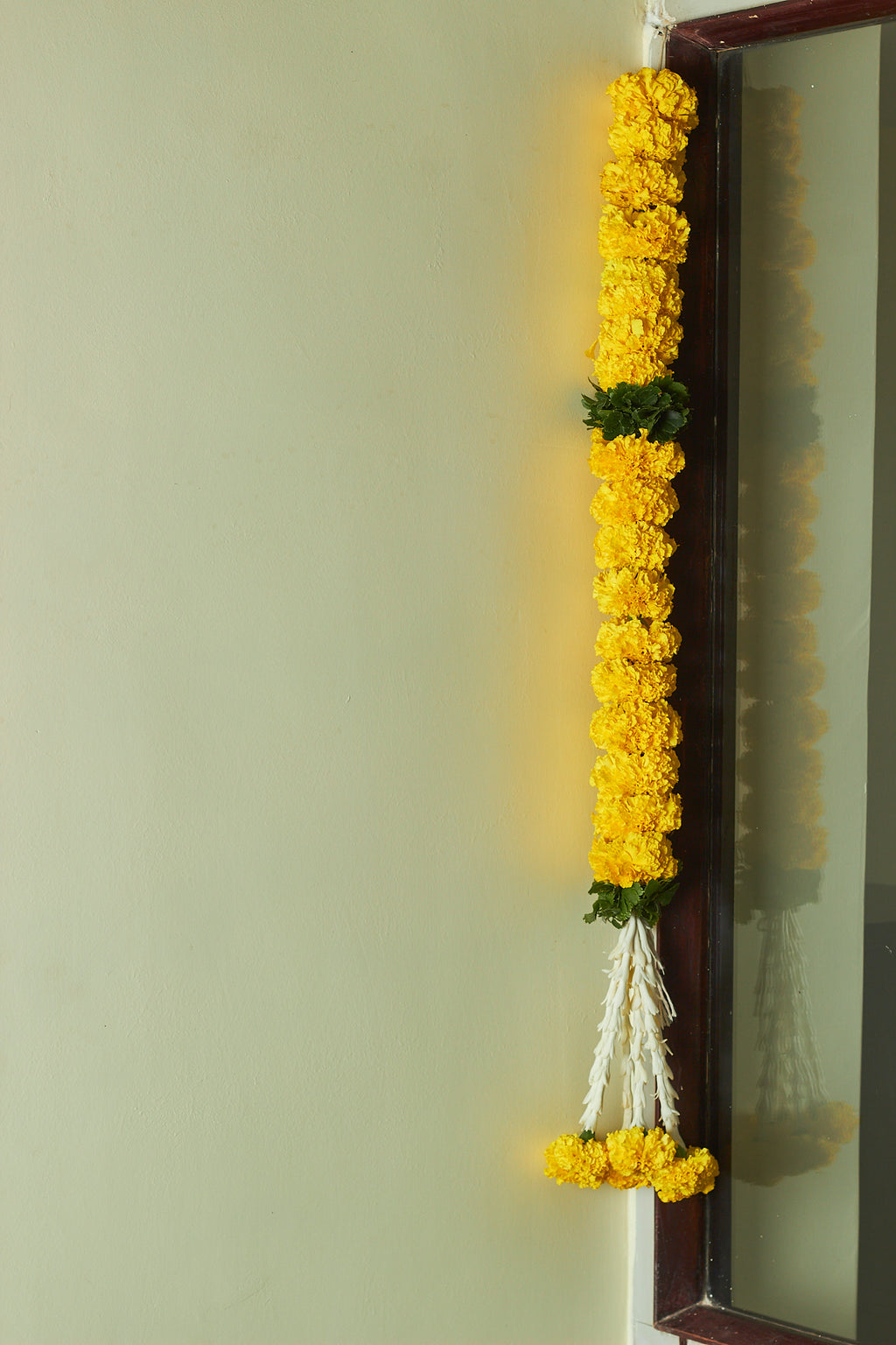 Buy Marigold & green Latkan by  Mahua Floral Studio.