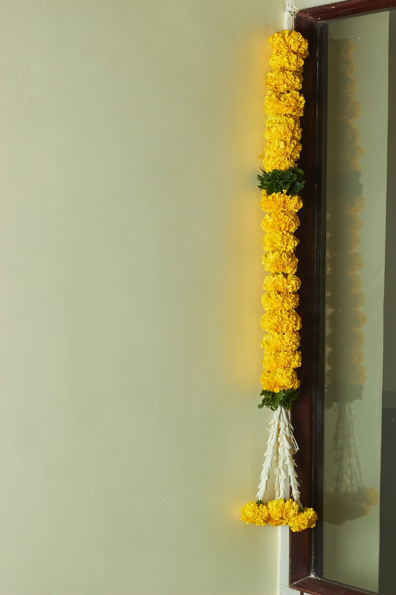 Buy Marigold & green Latkan by  Mahua Floral Studio.