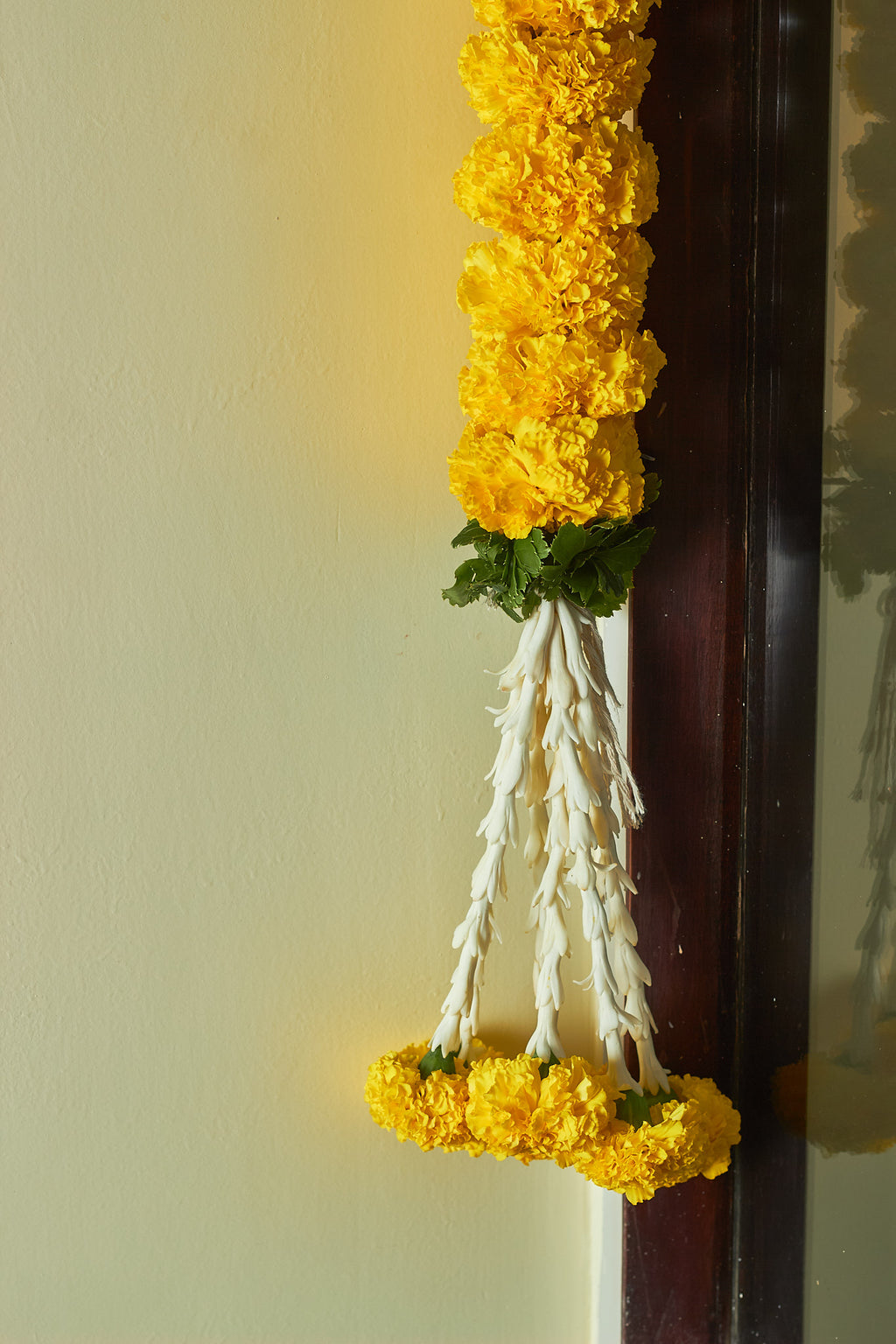 Buy Marigold & green Latkan by  Mahua Floral Studio.