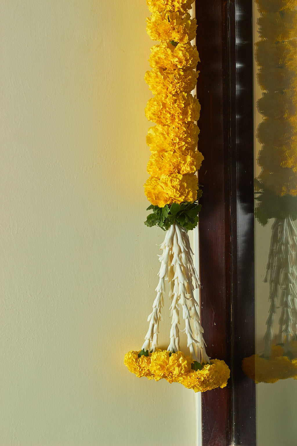 Buy Marigold & green Latkan by  Mahua Floral Studio.