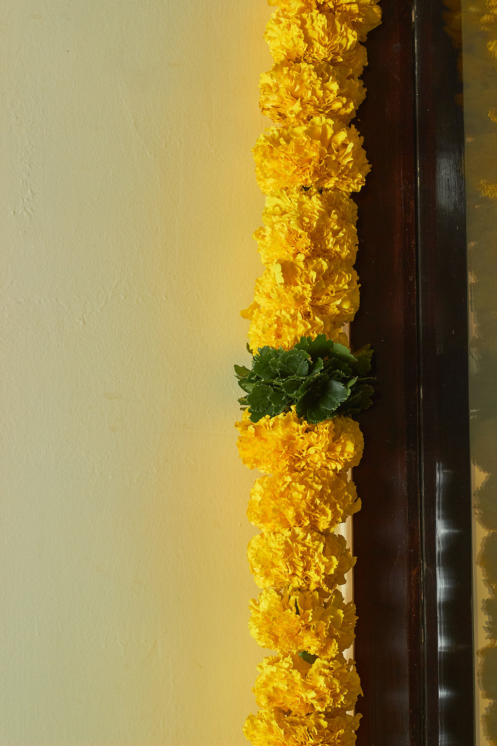 Buy Marigold & green Latkan by  Mahua Floral Studio.