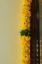 Buy Marigold & green Latkan by  Mahua Floral Studio.