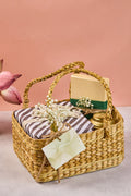 Water hyacinth basket with nicobar mugs and khajoor box and herbal tea from Sancha tea company with a gift card attached.